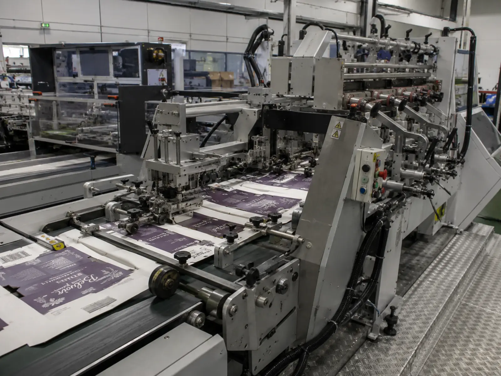 In-house packaging production machinery used for custom postal boxes